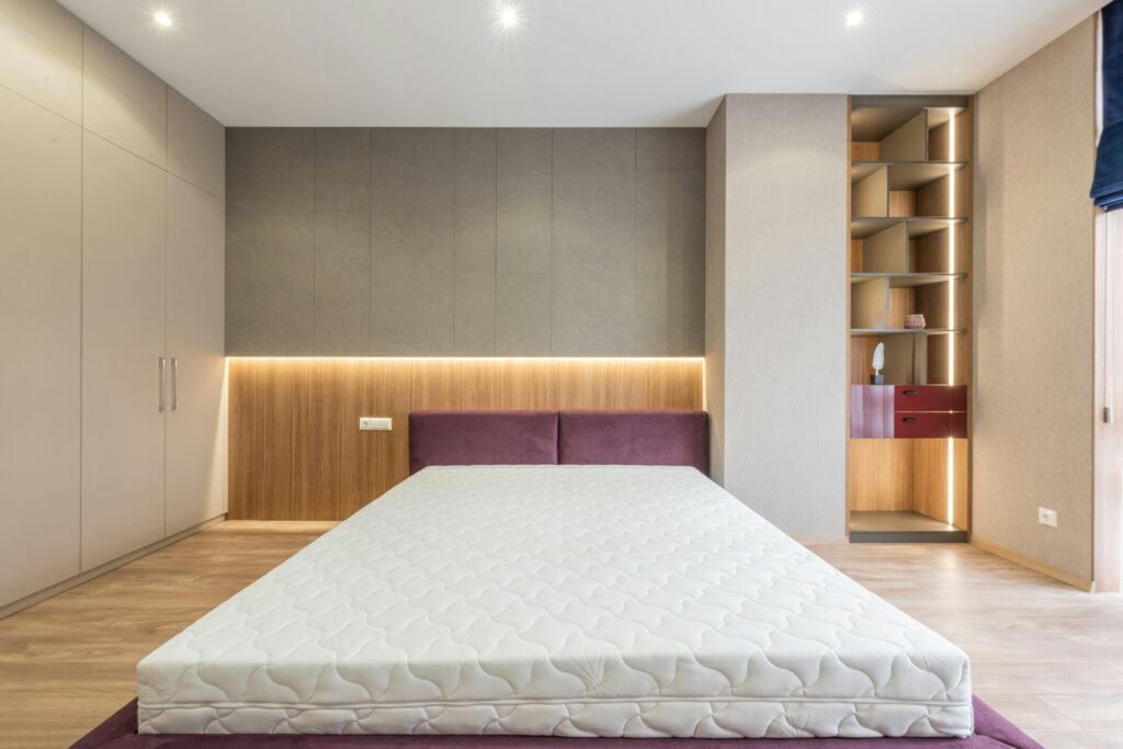 pexels-photo-6489082-6489082 Modern interior design of empty bedroom with cozy king size bed without sheets and empty closets